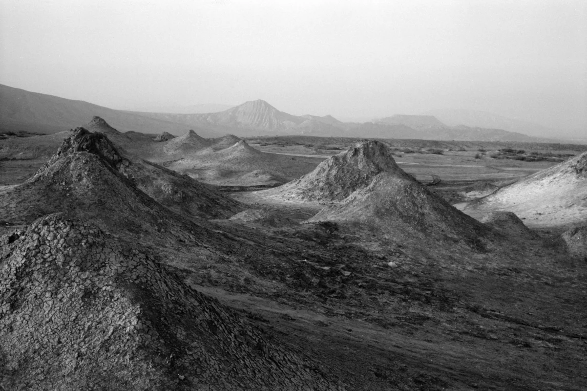 Black and white photography of volcanic natural landscape, capturing the essence of historical time by Zhao Rong.