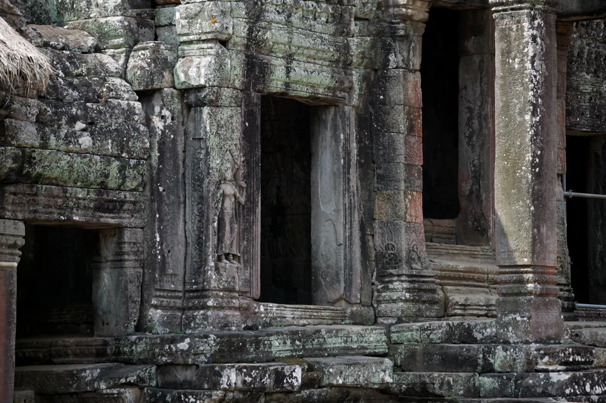 Ancient stone doorways and weathered architectural details within the ruins of Angkor, revealing the texture of time.