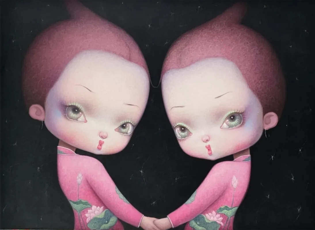 Two mirrored young girls in pink lotus-patterned dresses holding hands against a dark background.