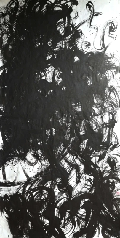 Large-scale black ink brushstrokes sweep across a white paper surface, with dense gestural lines and layered calligraphic marks forming a dynamic abstract composition.