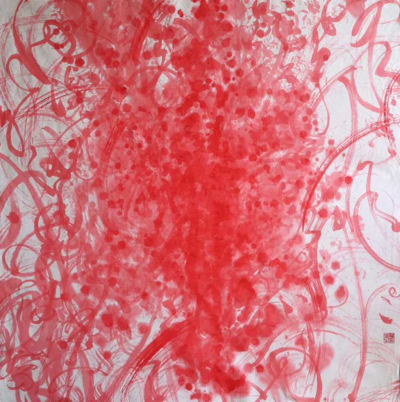 Vivid red ink gestures and calligraphic lines spread across a white paper surface, forming a dense central mass surrounded by splashes and energetic abstract marks.