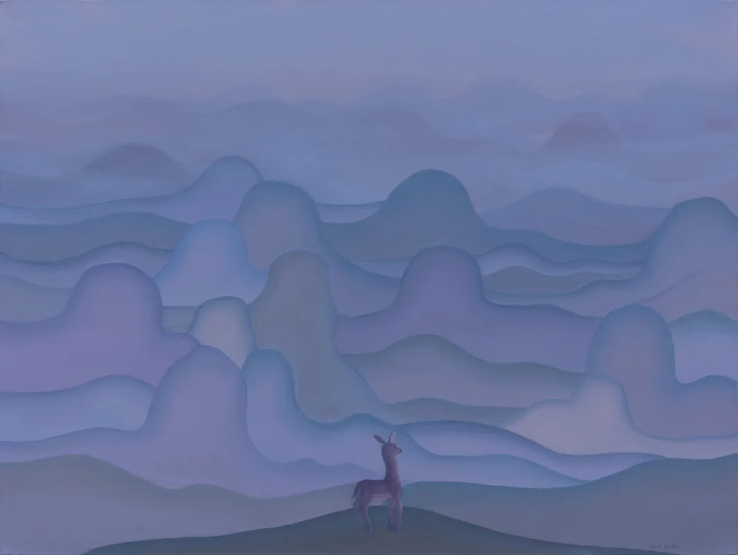 A deer stands among softly illuminated mountains at dawn, as mist drifts across an expansive dreamlike landscape.