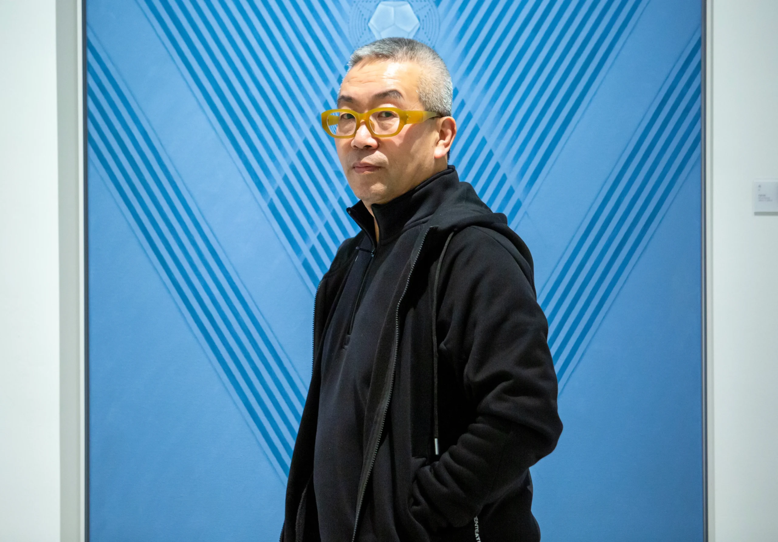 A contemporary artist who reconstructs traditional Chinese cultural symbols through the visual language of the digital age.